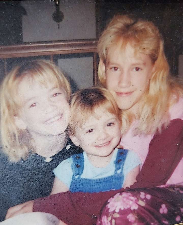 Old picture of three young sisters.