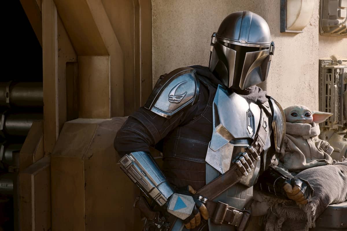 The Mandalorian (Pedro Pascal) and the Child in THE MANDALORIAN, season two, exclusively on Disney+