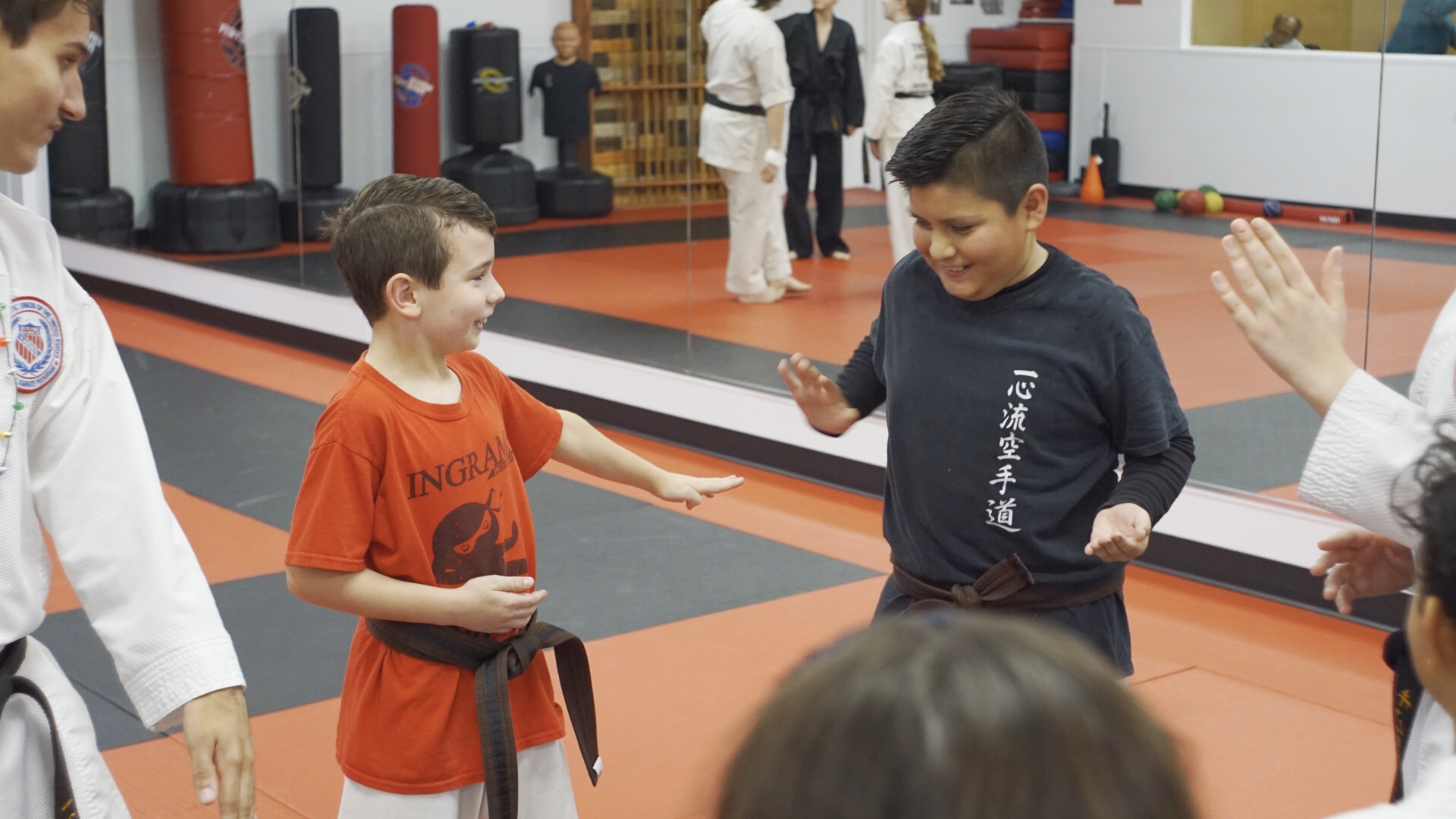 Karate students play "Ninja Tag" in a circle.